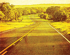 The right inside cover for Valley Revival by Steven Bills. Showcasing a country road with a tint to give it a rustic feel.
